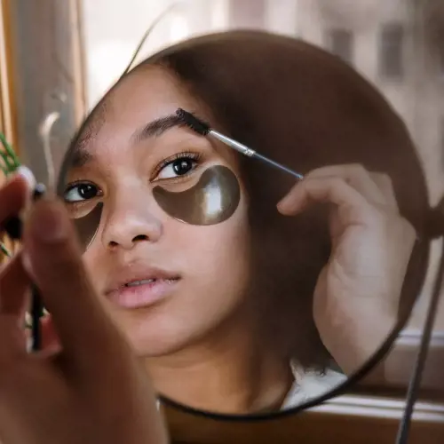 Applying eyebrow products with a flicking motion